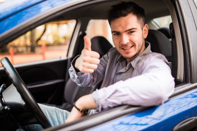 GTB driver at the wheel giving a thumbs up